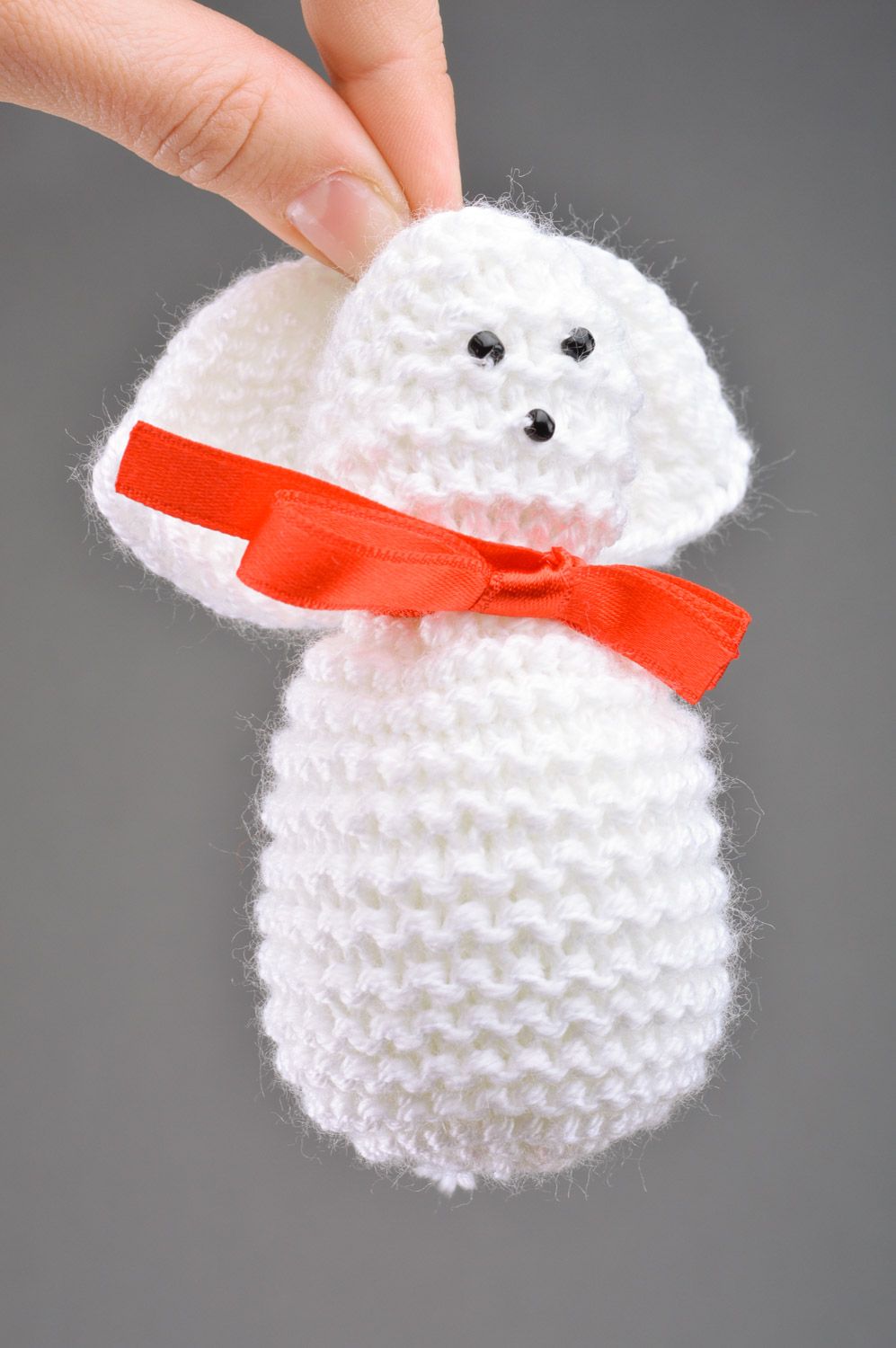 Handmade soft toy knitted of white threads Rabbit with bow for children photo 3
