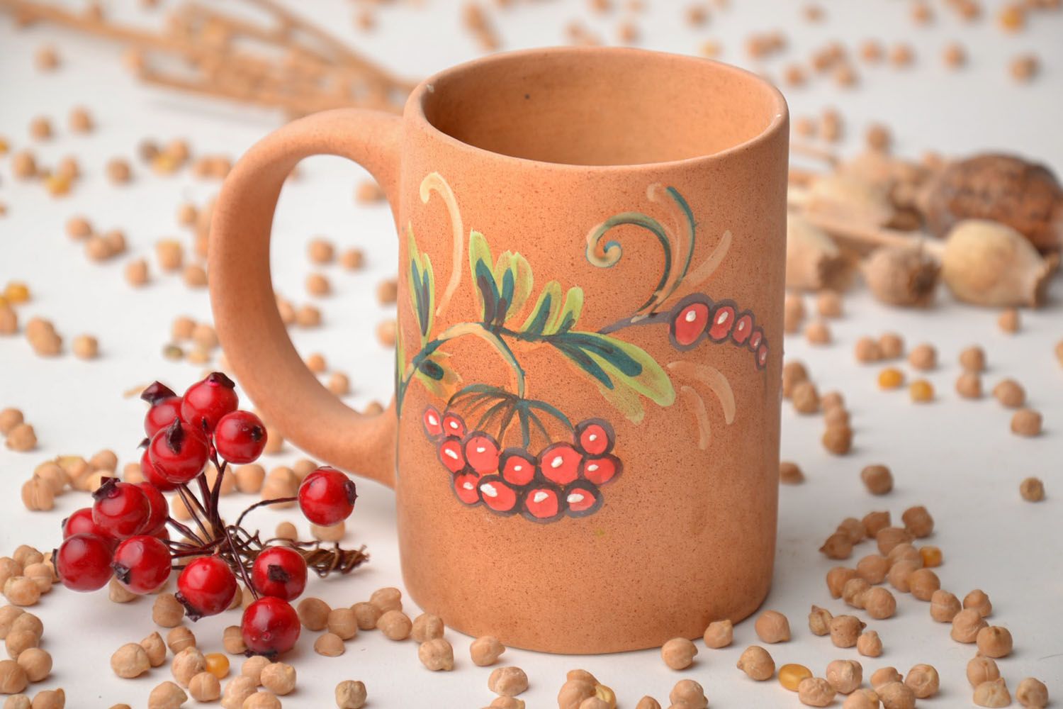 Handmade natural clay glazed coffee mug with handle and hand-painted floral pattern photo 1