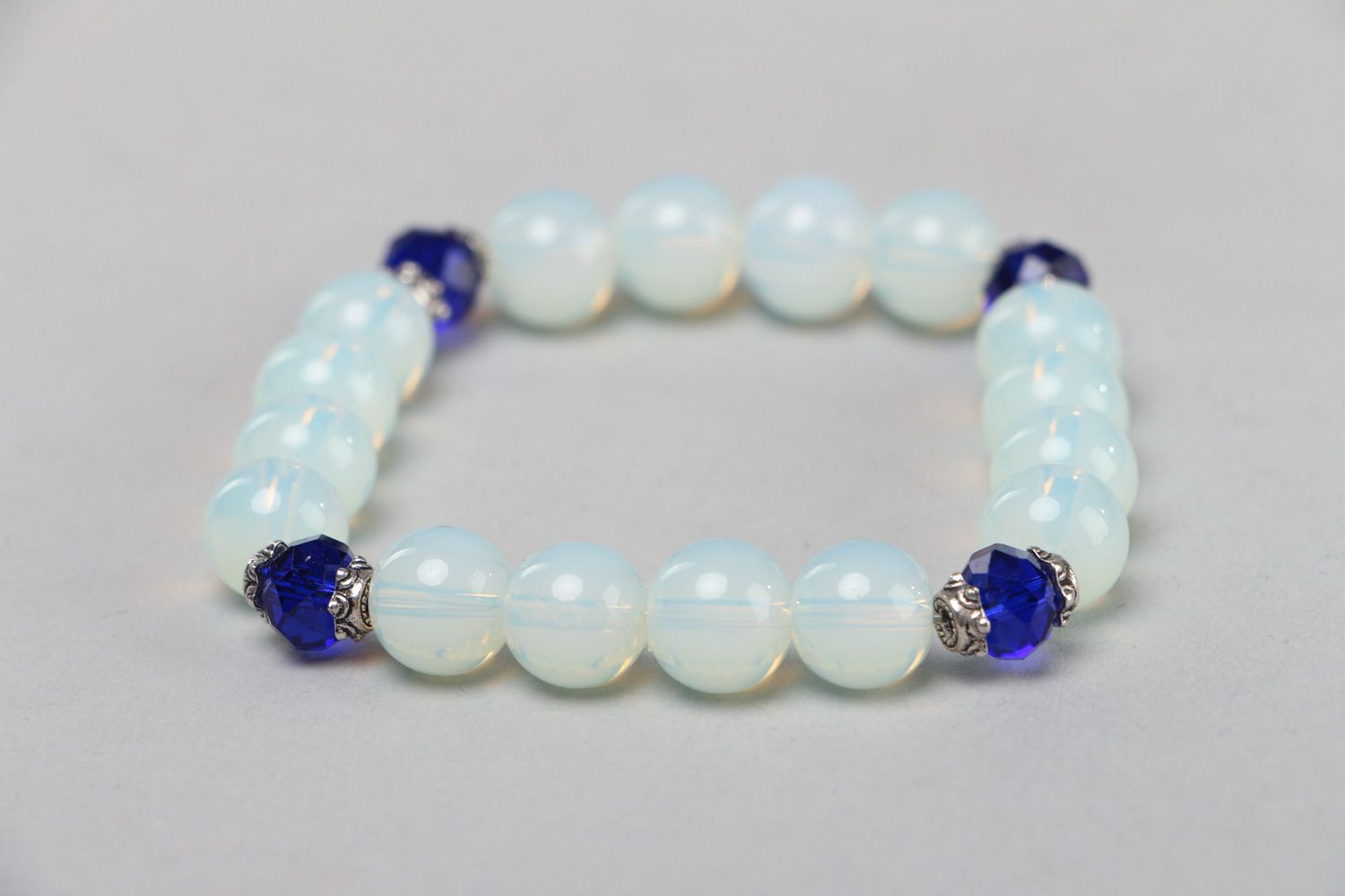 Handmade stretch wrist bracelet with moon stone and blue glass beads for women photo 1