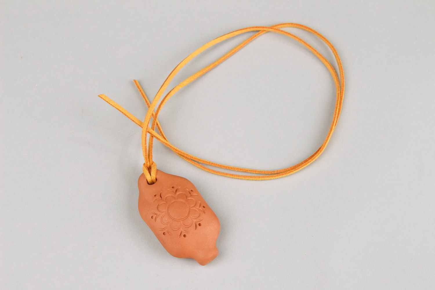 Tin whistle pendant made of clay with flower photo 5