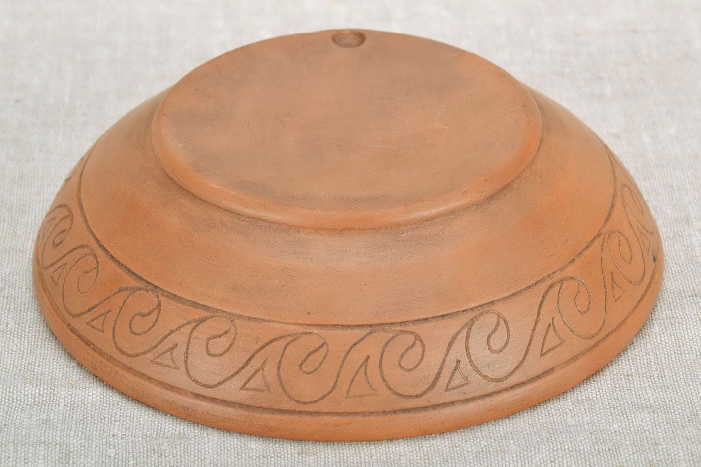 Clay bowl with an ornament photo 2