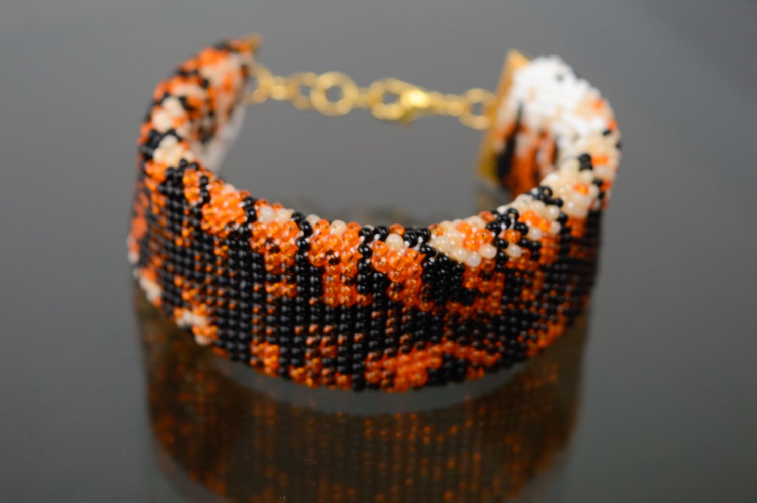 Adjustable handmade black and orange beads bracelet with tiger coloring  photo 1