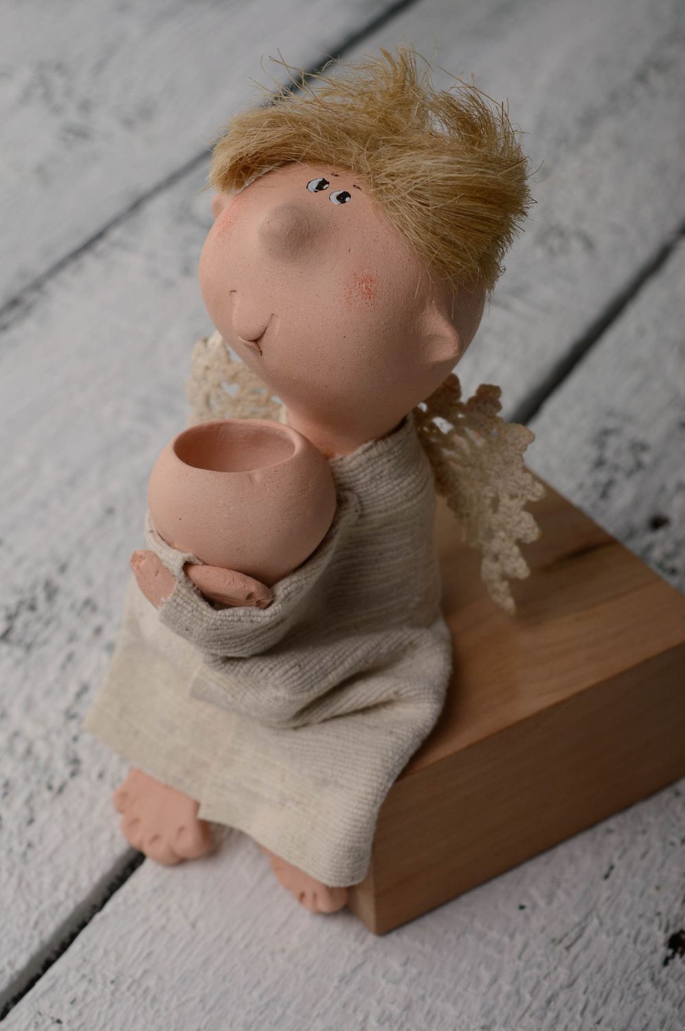 Ceramic figurine of sitting angel photo 1