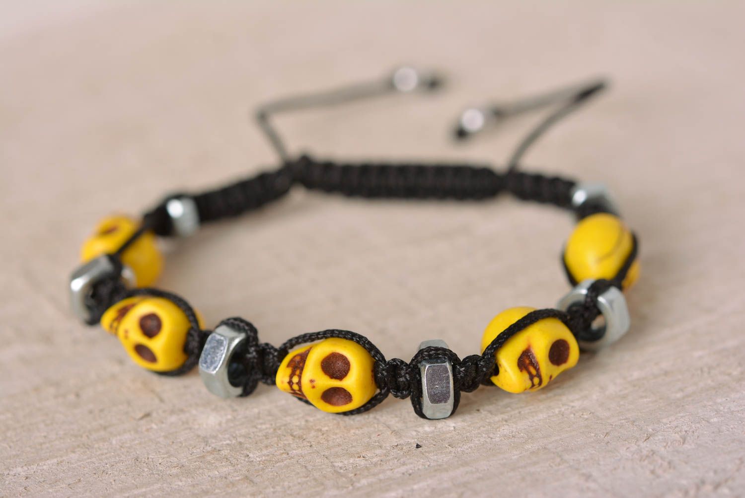 Handmade yellow skull beaded black cord bracelet with female screws photo 1