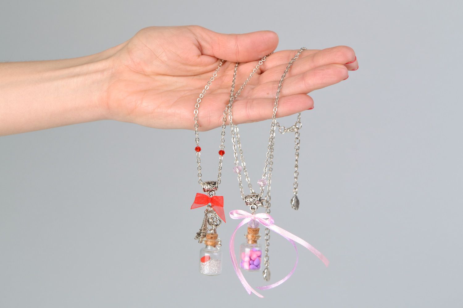 Set of 2 handmade designer glass bottle pendants on long metal chains  photo 2