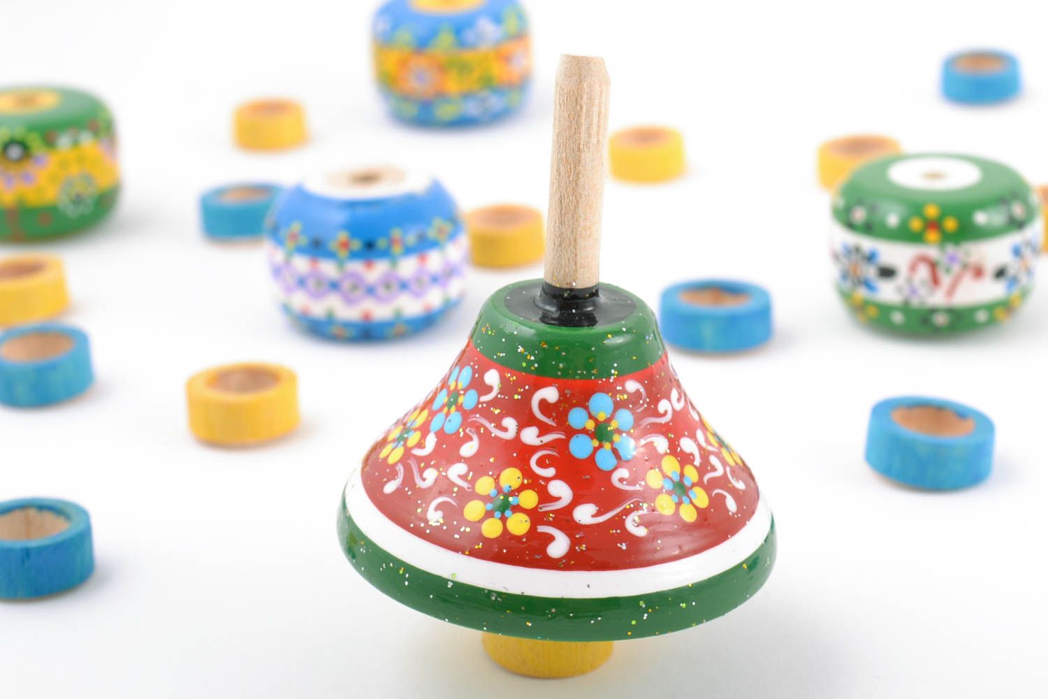 Handmade Öko Spielzeug bunter Brummkreisel aus Holz mit Bemalung für Kleinkind foto 1