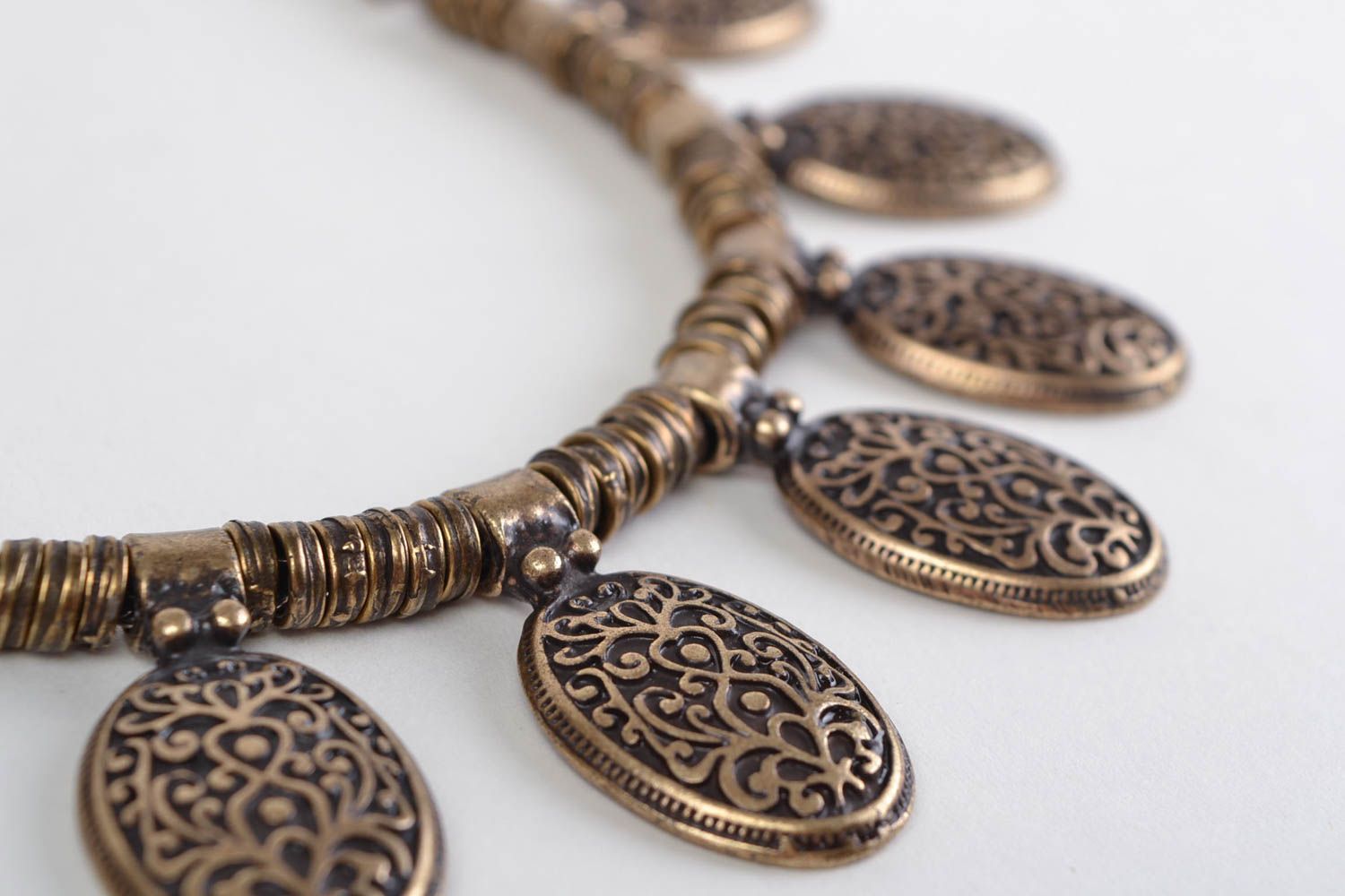 Handmade designer metal necklace of bronze color in ethnic style photo 4