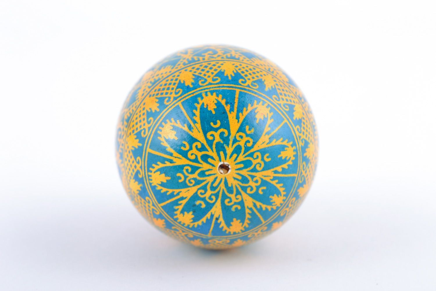 Bright painted handmade Easter egg with rich pattern of yellow and blue colors photo 5