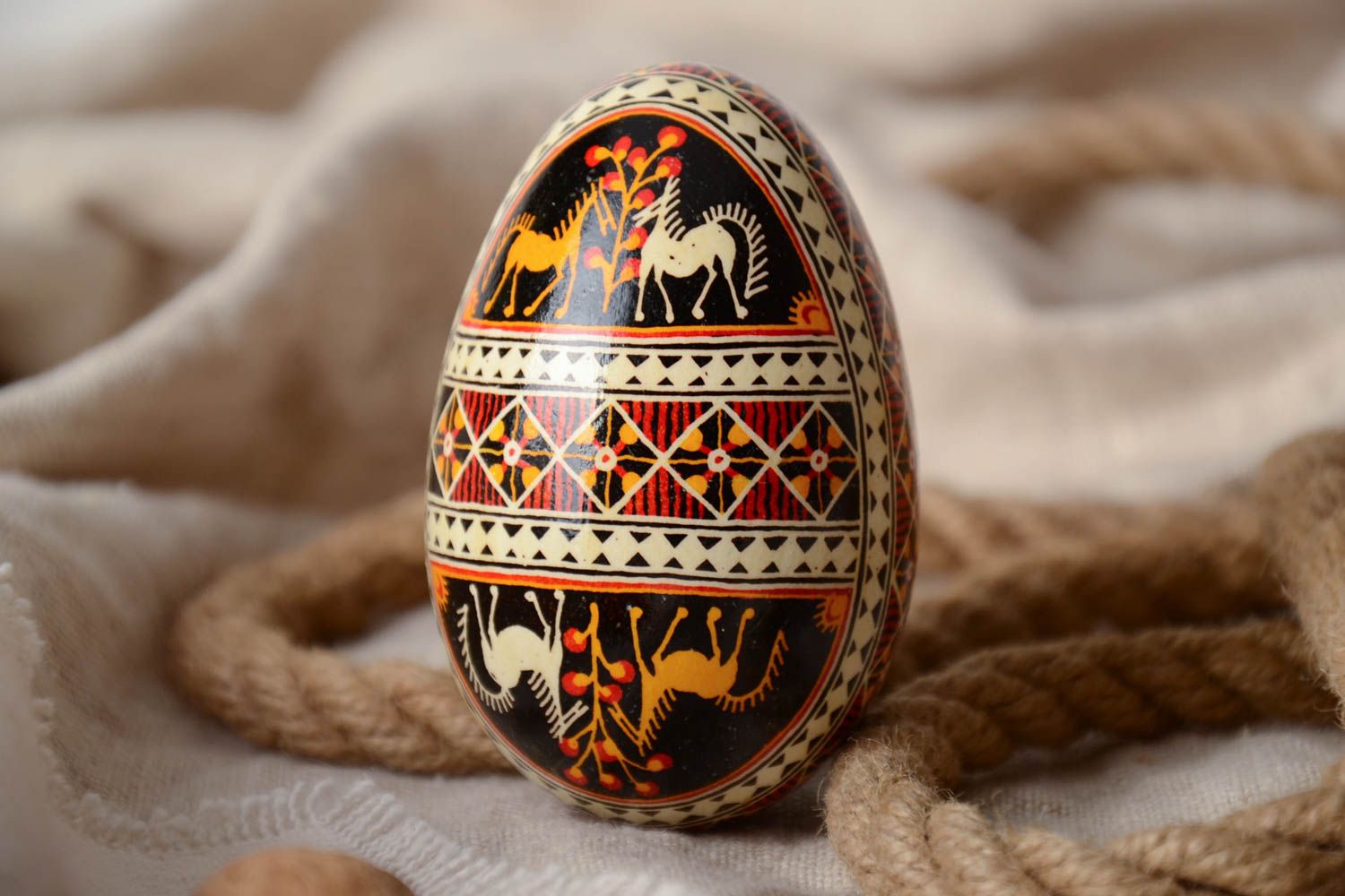 Handmade decorative art painted Easter egg traditional pysanka with horses image photo 1