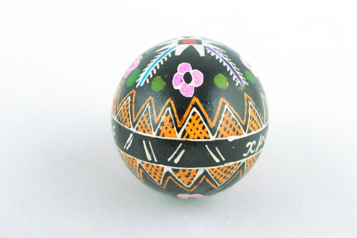 Homemade Easter egg with traditional ornament on black background made with hot wax photo 4