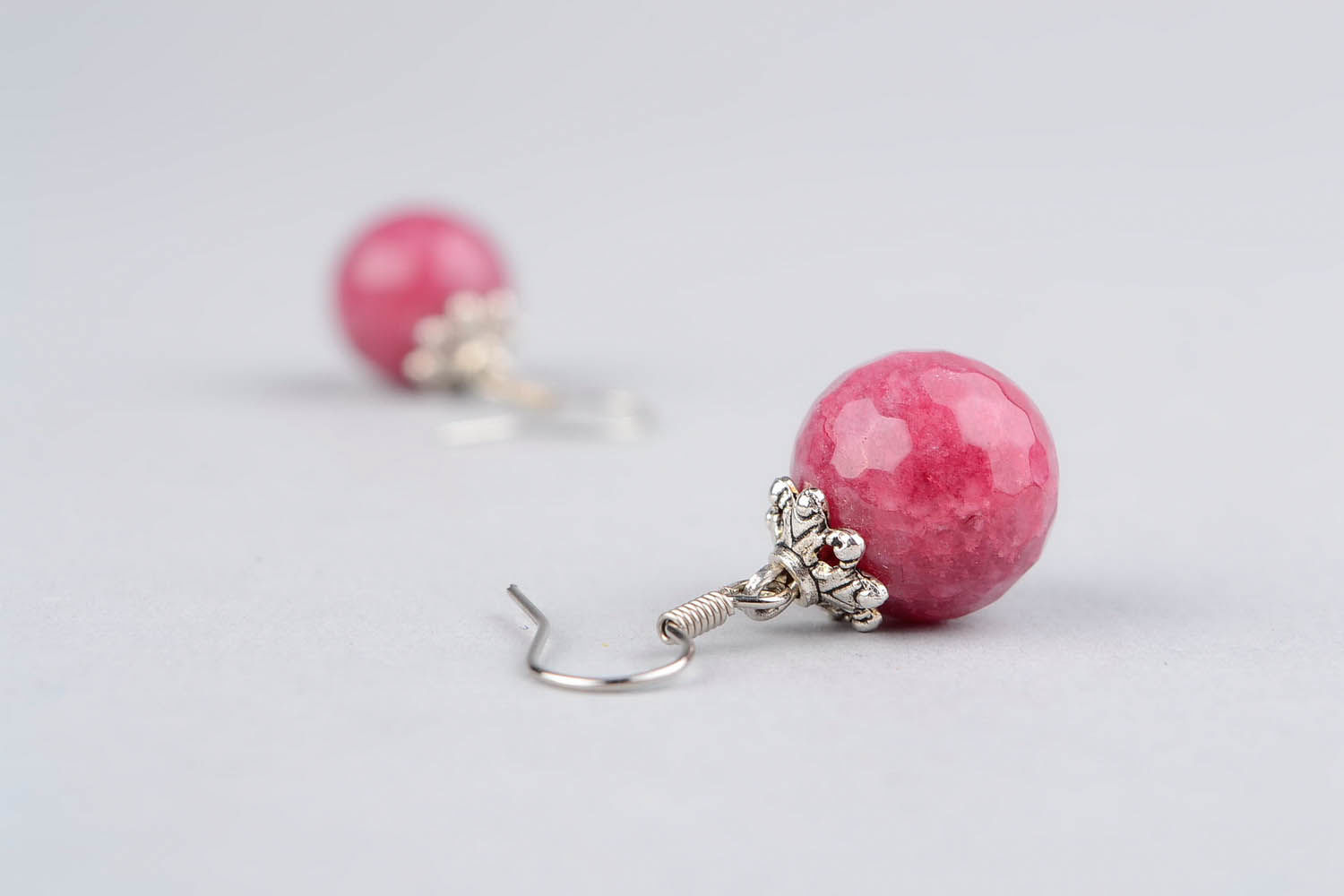 Ball earrings with a young ruby photo 4