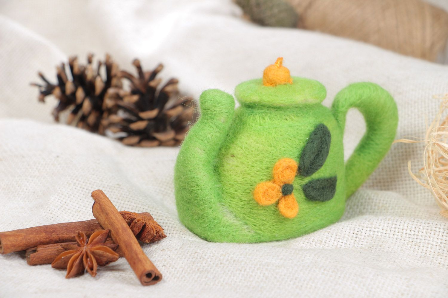 Handmade decorative toy made using the technique of dry felting green kettle with eyelet photo 1