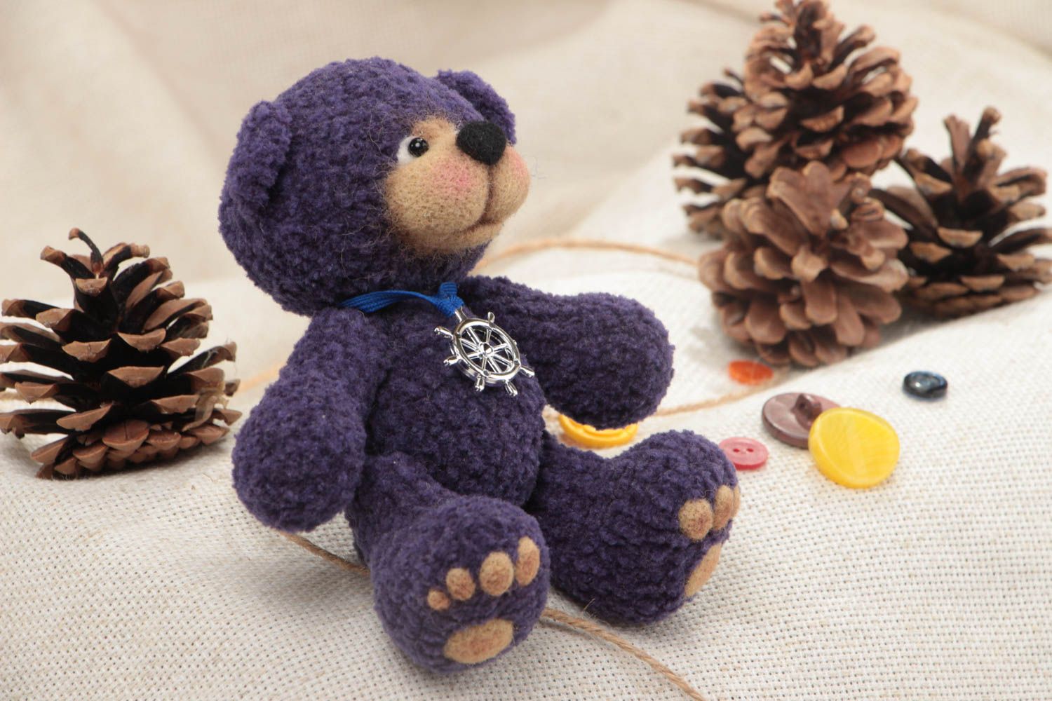 Handmade designer soft toy crocheted of woolen threads blue bear with charm photo 1