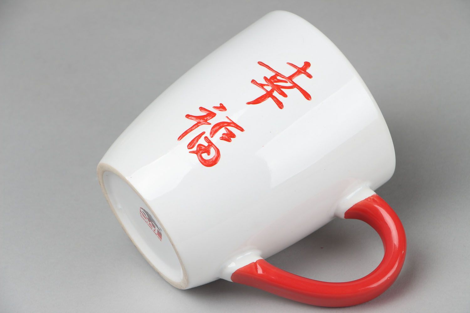 Japanese style white ceramic coffee or tea cup with red handle photo 2