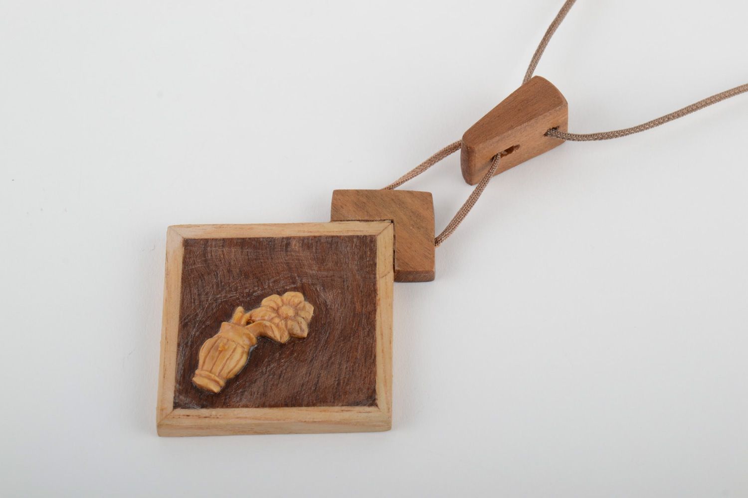 Handmade neck pendant carved of wood and decorated with inlay on synthetic cord photo 3