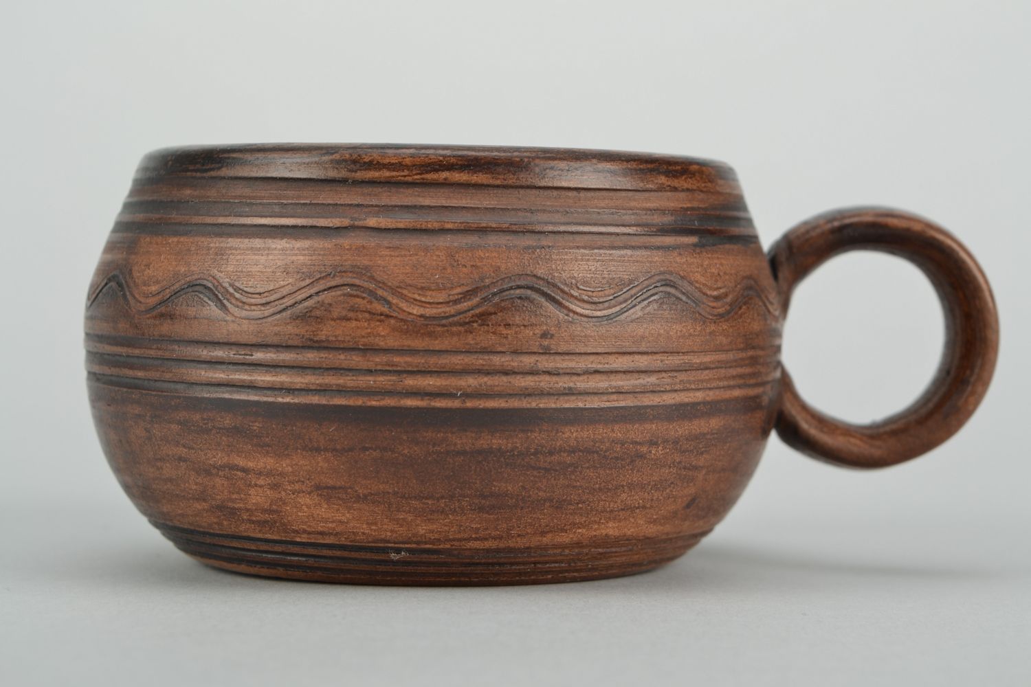 Medium size  5 oz clay cup in pot shape with handle in brown color photo 1