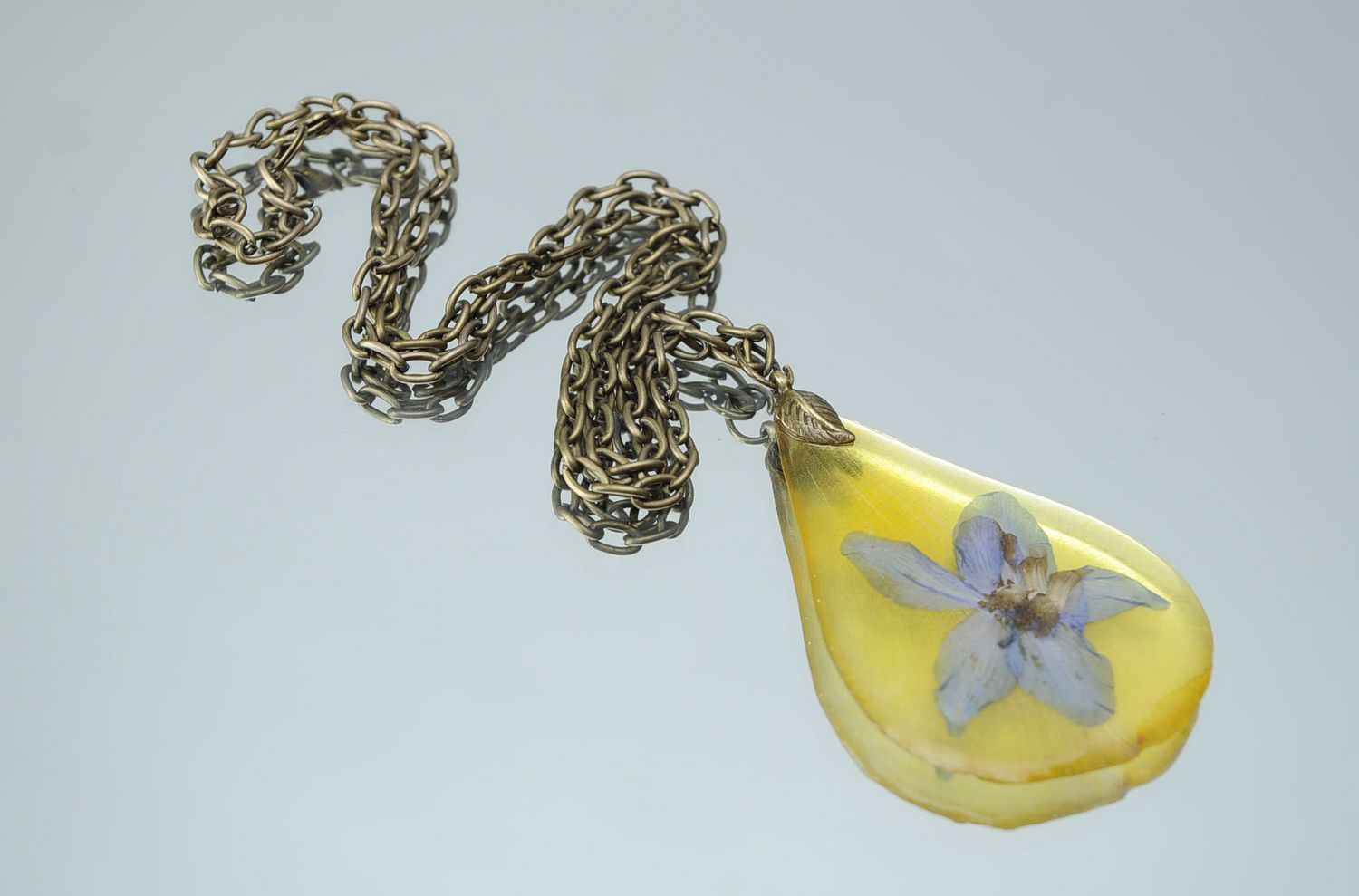 Pendant covered with epoxy Petal of tulips and delphinium photo 4