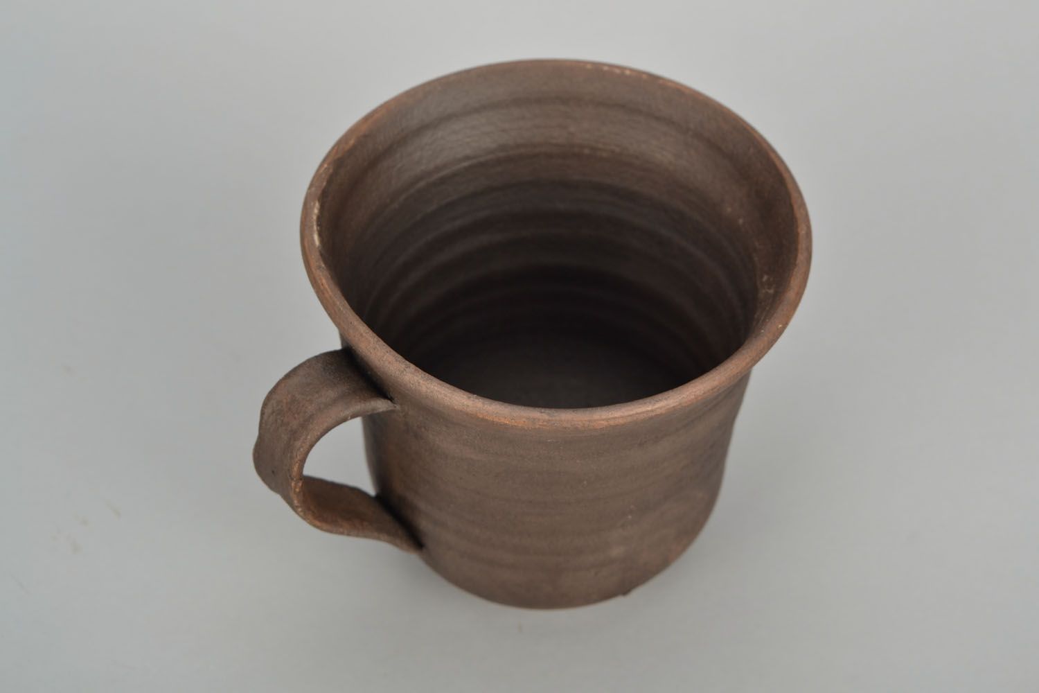 5 oz brown clay cup with handle and no pattern photo 4