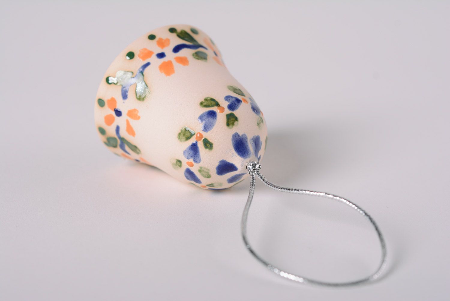 Handmade decorative light maiolica ceramic hanging bell ornamented with glaze photo 5