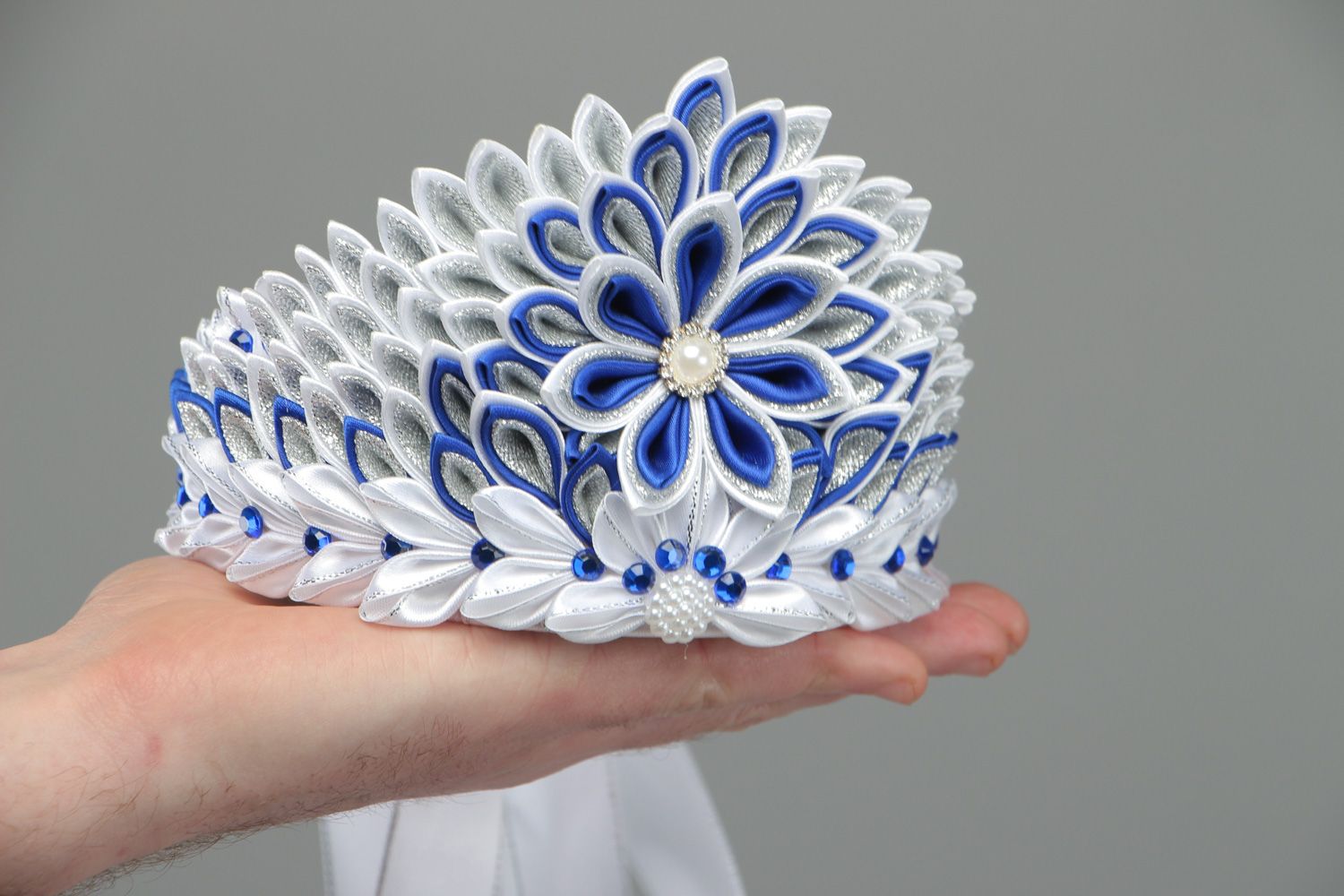 Beautiful volume handmade crown with satin ribbons in white and blue color palette photo 4