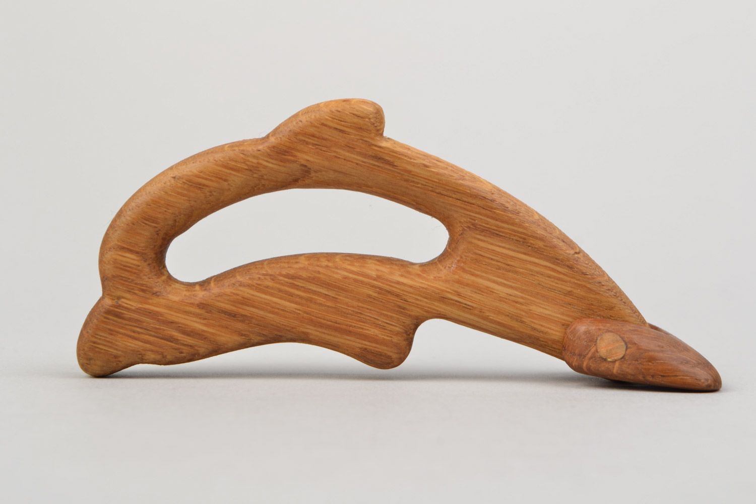 Handmade wooden teething toy in the shape of dolphin imbued with linseed oil photo 1