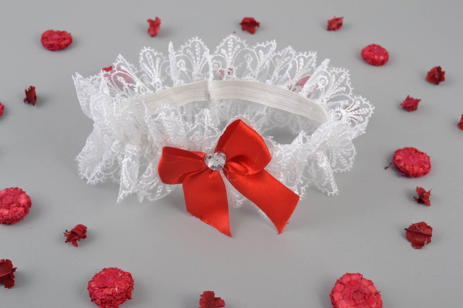 Handmade designer white lacy guipure wedding bridal garter with red satin bow photo 1