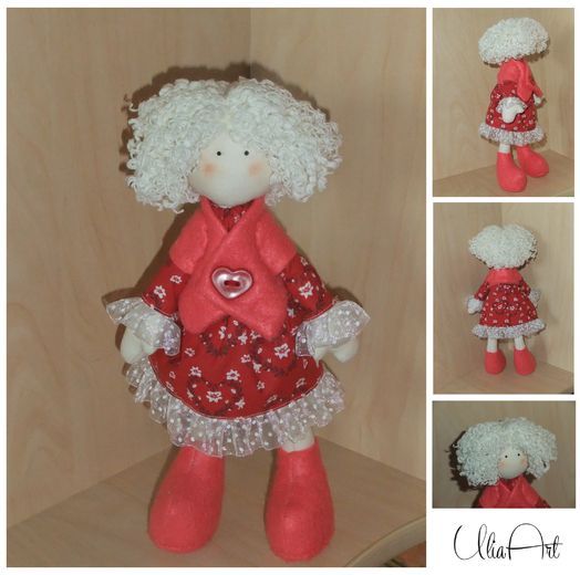 Mittelgroße originelle handgemachte Puppe aus Stoff mit weißen Haaren im roten Kleid foto 1