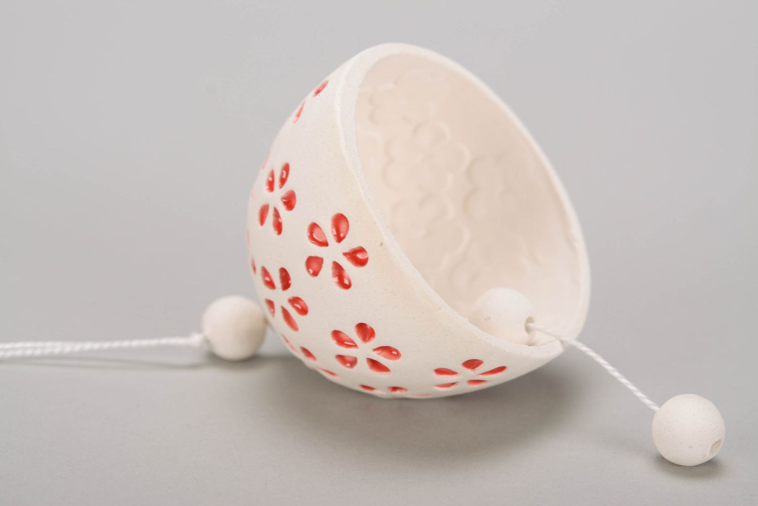 Molded bell made of white clay with embossing photo 3