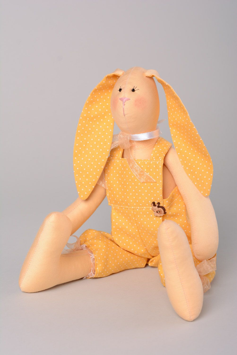 Handmade designer soft toy sewn of natural fabrics in yellow color palette Rabbit photo 1