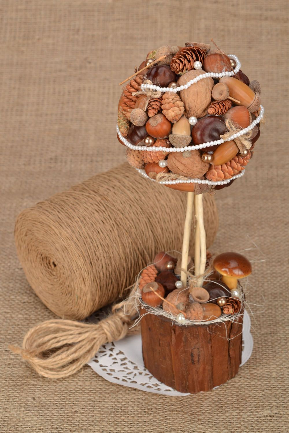 Handmade topiary with nuts, cones and acorns photo 1