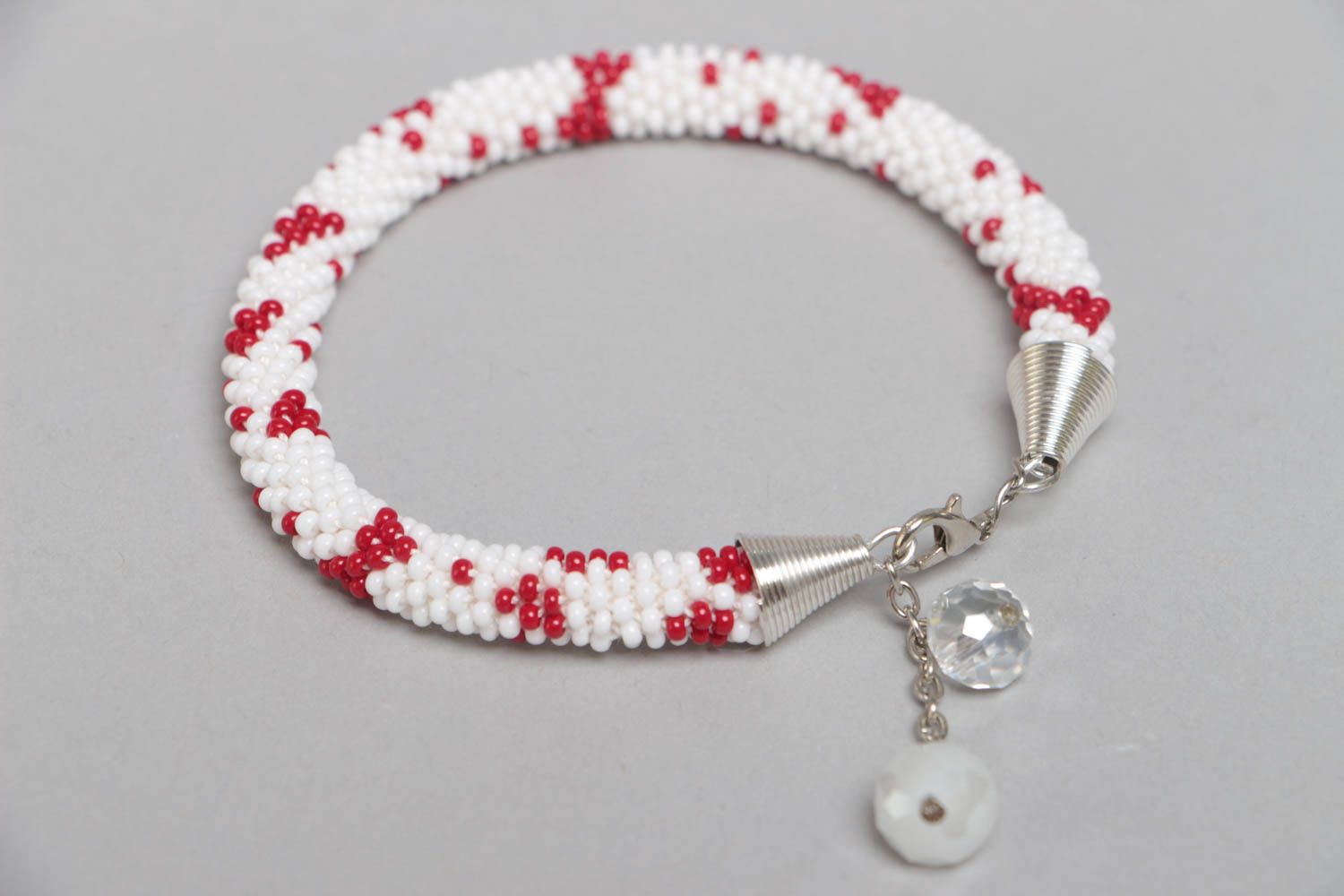 Handmade designer white and red beaded cord women's wrist bracelet with charms  photo 4