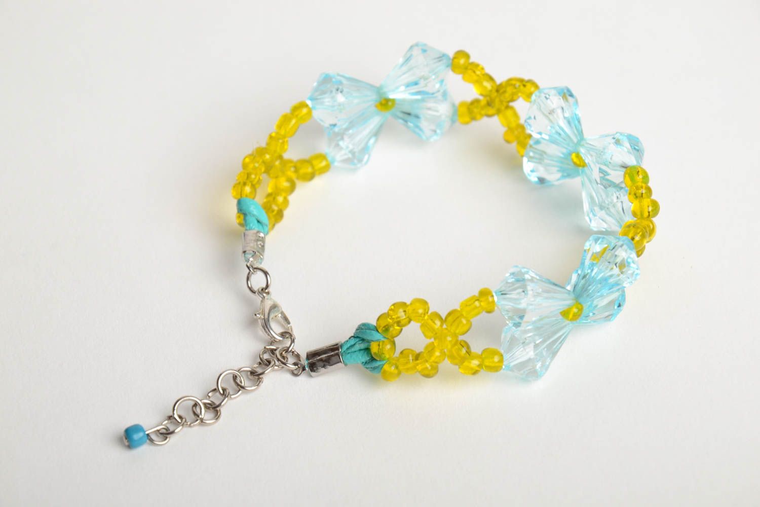 Handmade woven yellow and blue beaded wrist bracelet with blue figured beads photo 4