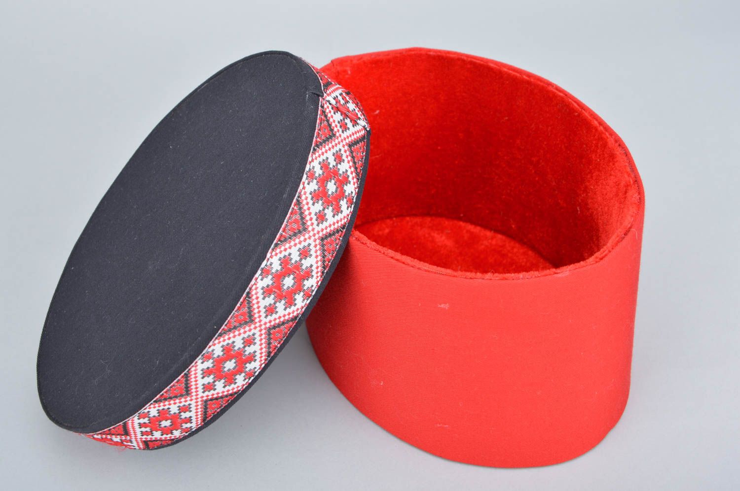 Handmade decorative oval carton box covered with red fabric with ethnic motifs photo 3