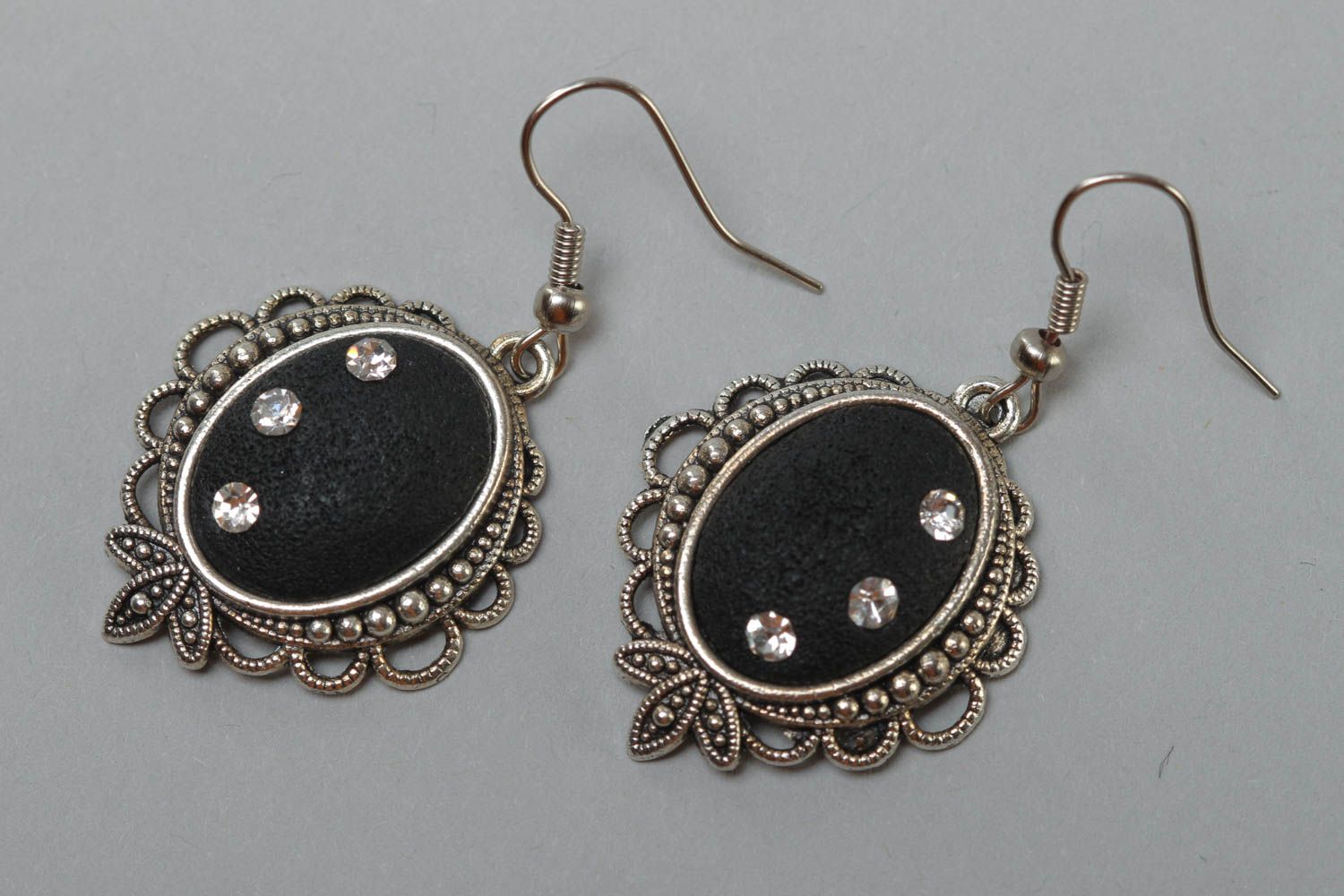 Black handmade oval polymer clay earrings in metal frame photo 2