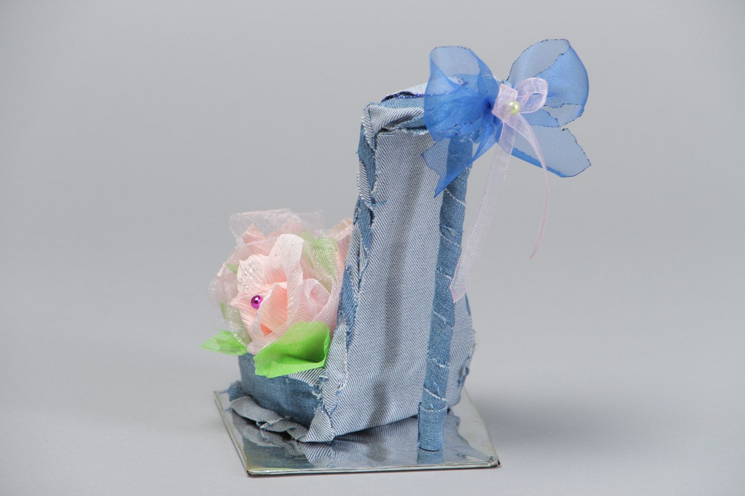 Handmade decorative fabric and paper shoe with flowers on holder floristics ideas photo 3