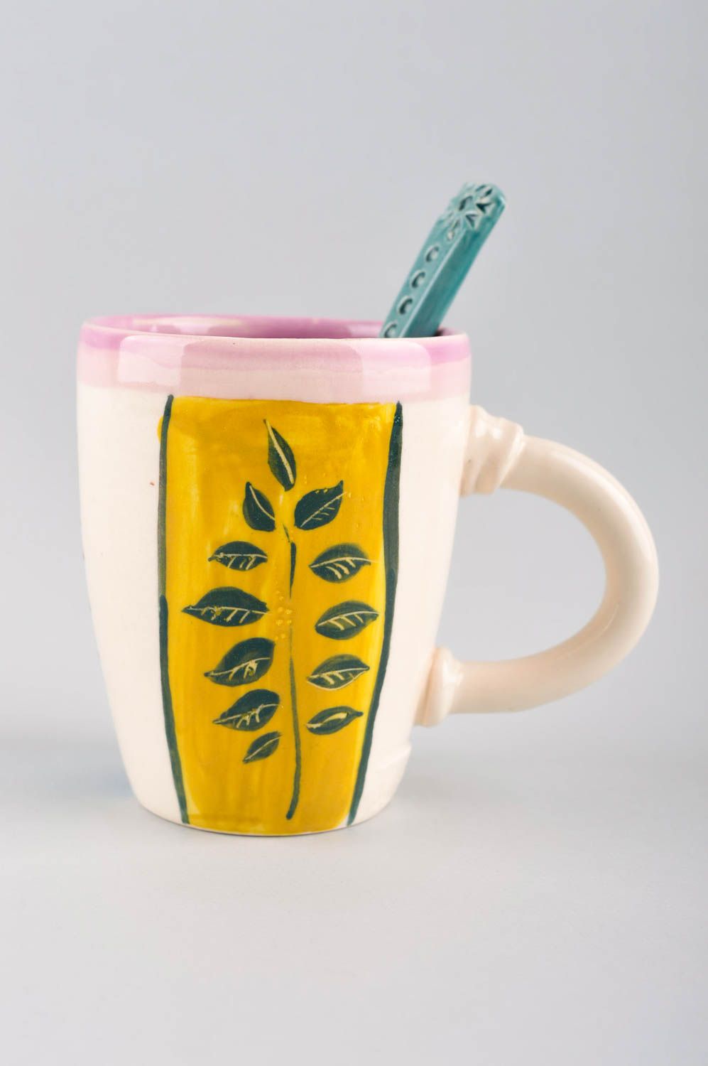 Glazed ceramic kids' drinking cup with ceramic spoon and bright pattern photo 2