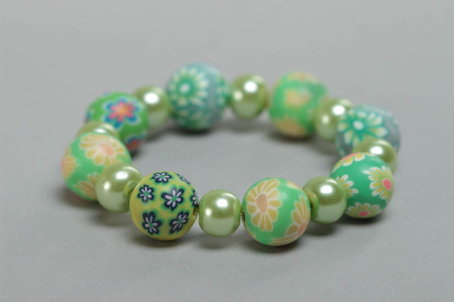 Beautiful children's handmade polymer clay wrist bracelet of green color photo 3