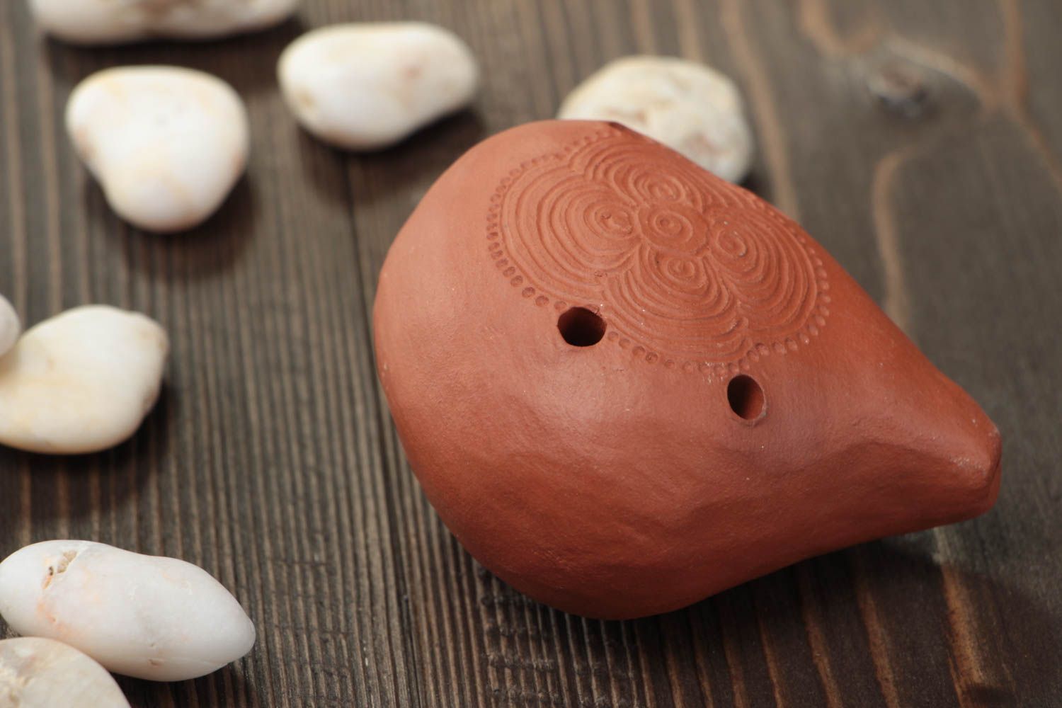 Handmade decorative brown ceramic musical instrument ocarina with ornament photo 1