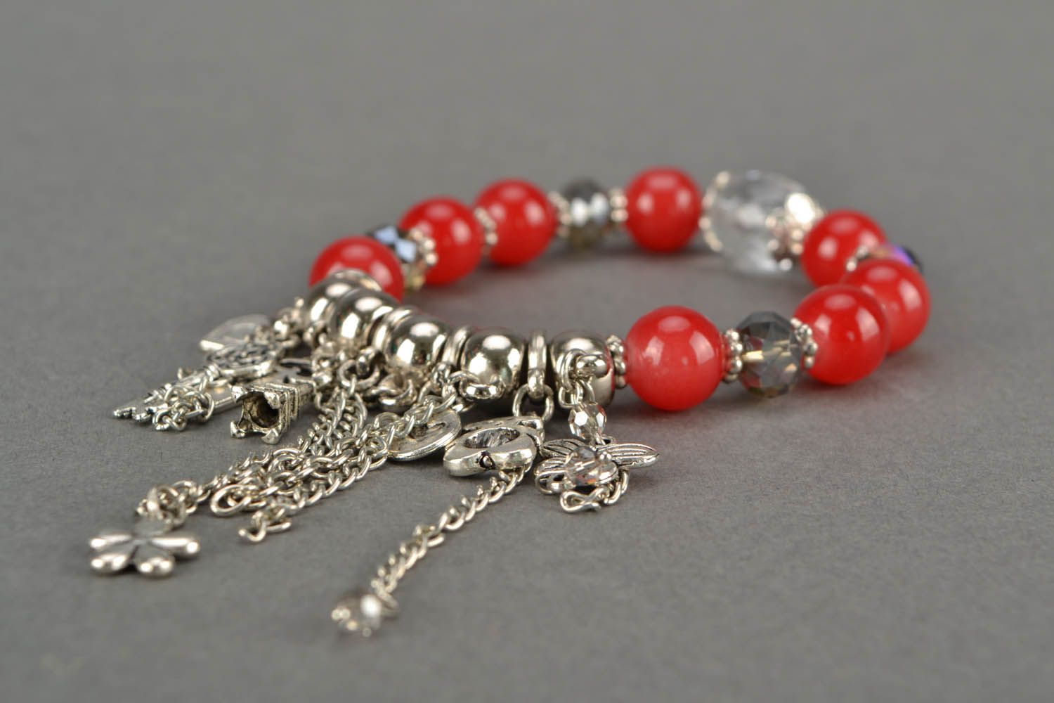Red bracelet with charms photo 5