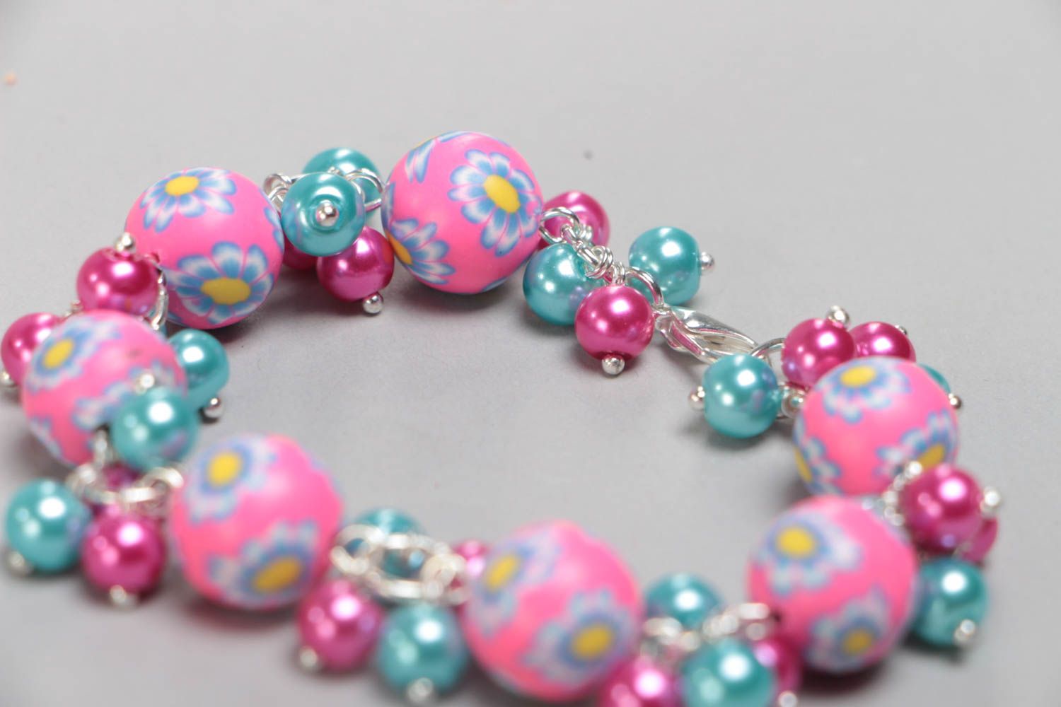 Beautiful bright handmade children's bracelet with plastic and ceramic beads photo 4