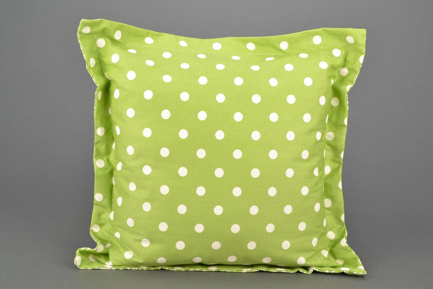 Handmade accent pillow of olive color with dotted print photo 2