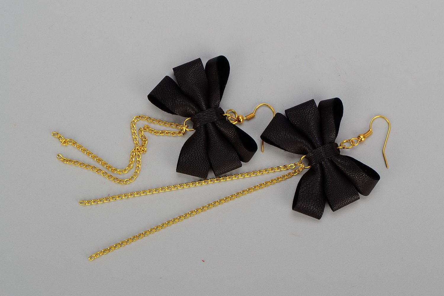 Leather earrings with gilt metal Bows photo 3