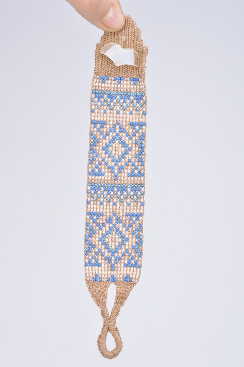 Handmade broad wrist bracelet woven of beige and blue beads with ornament photo 3