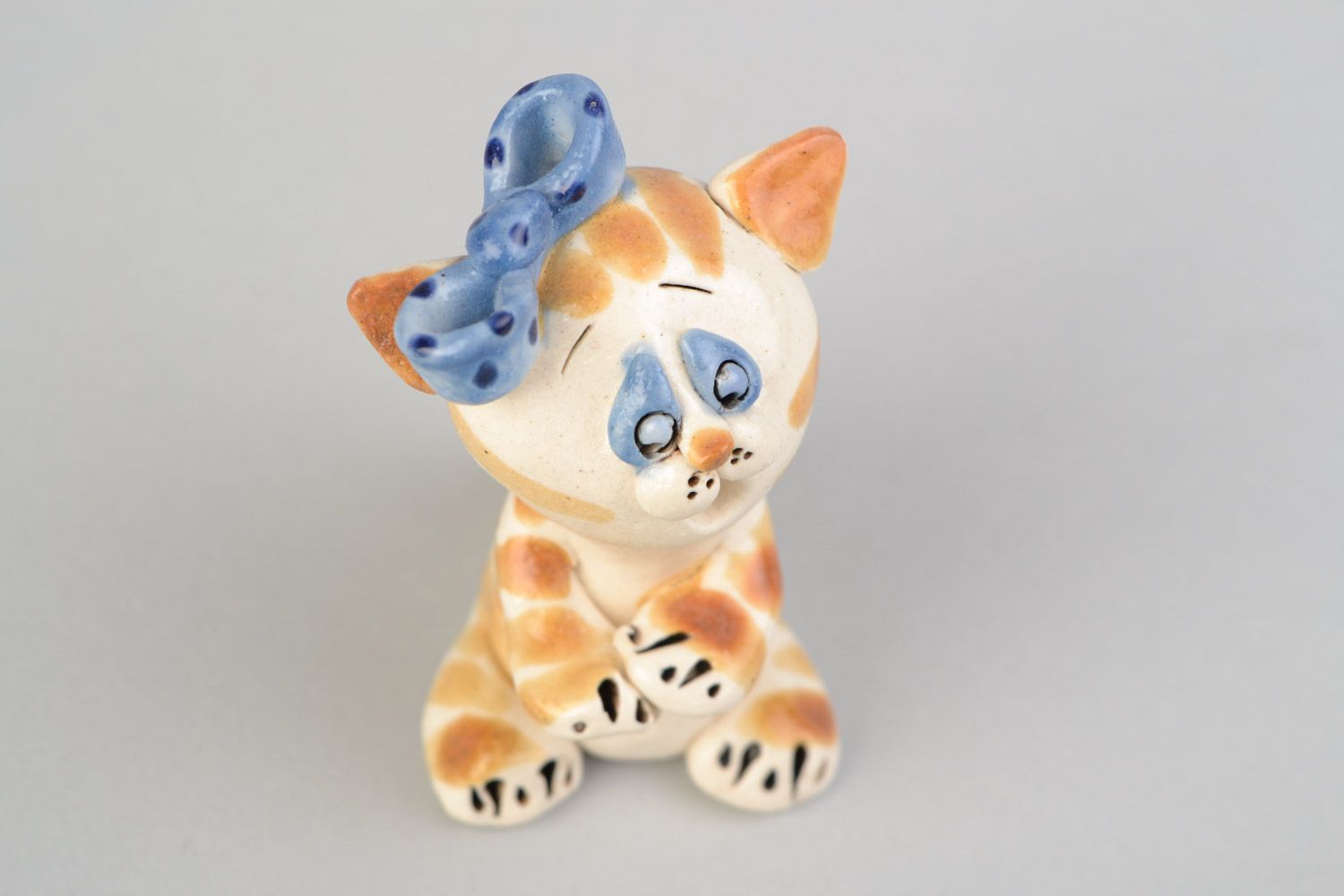 Handmade decorative miniature glazed ceramic figurine of kitten with blue bow photo 3