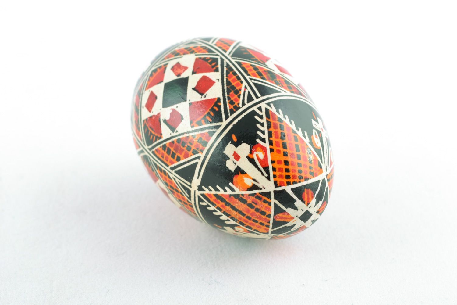 Homemade traditional colorful Easter egg painted with wax and aniline dyes photo 4