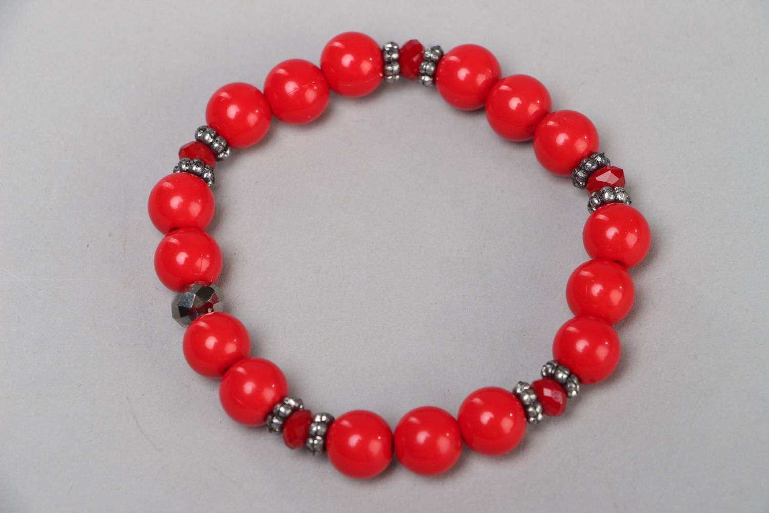 Women's red bracelet hand made of plastic and glass beads in 1 turn photo 2