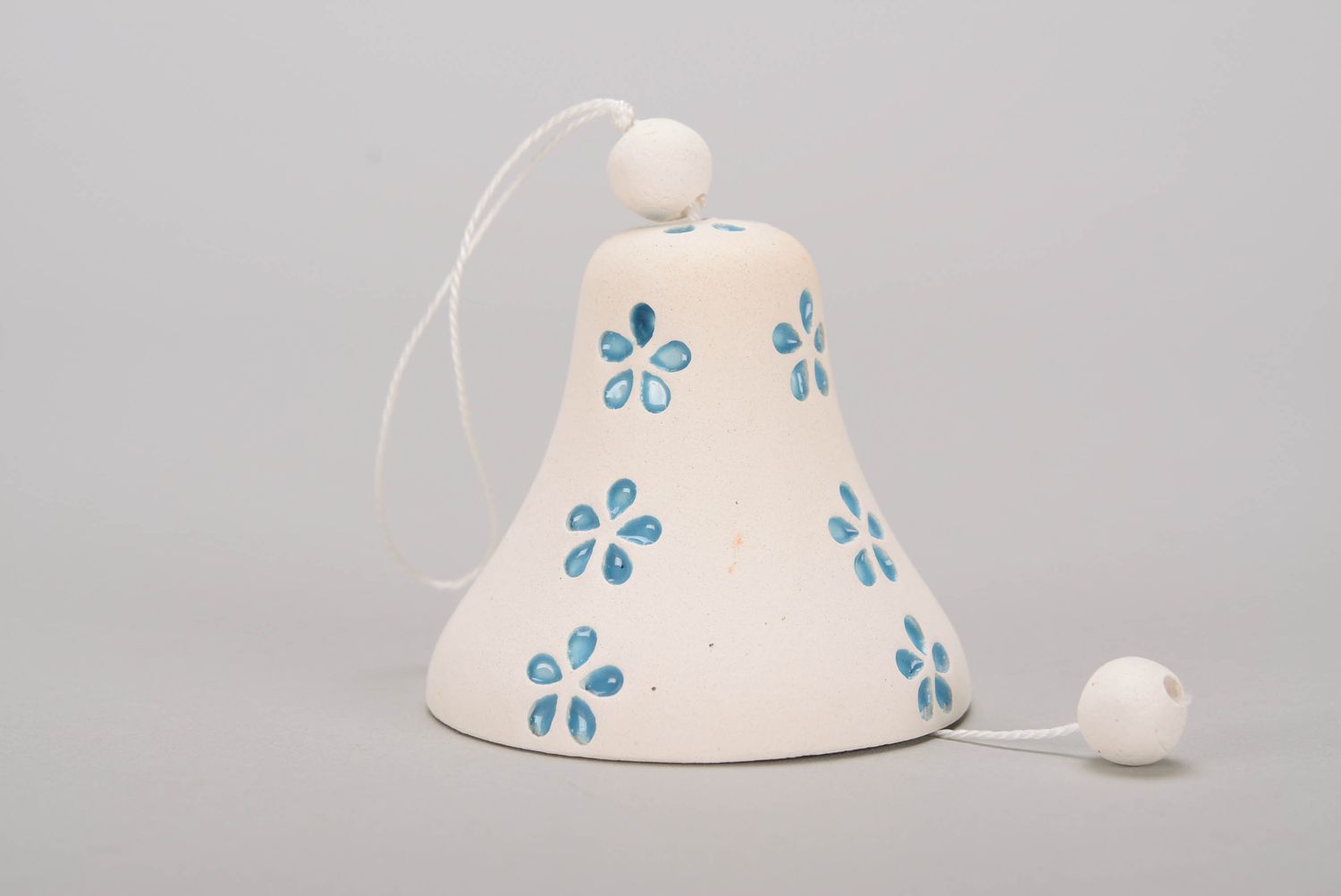 Bell made of white clay photo 1