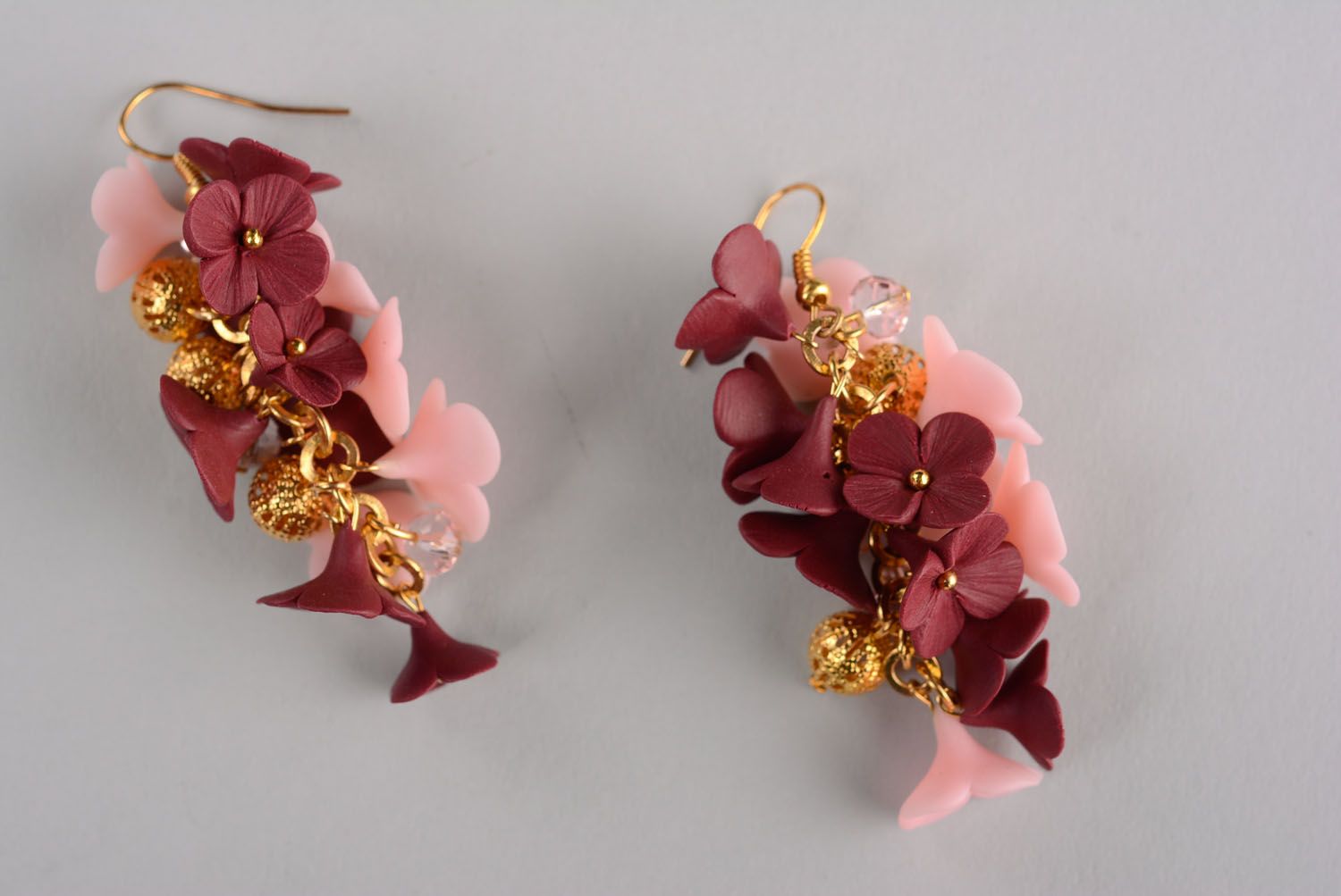 Beautiful earrings in the shape of flowers photo 1