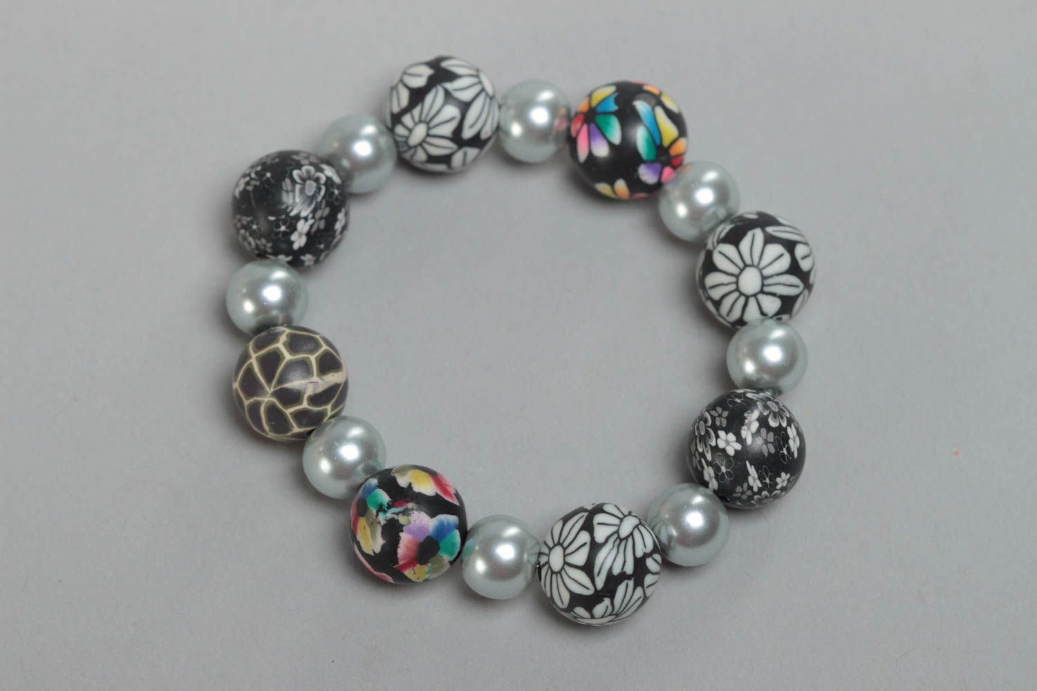 Beautiful gray handmade designer children's plastic bracelet with ceramic pearls photo 2