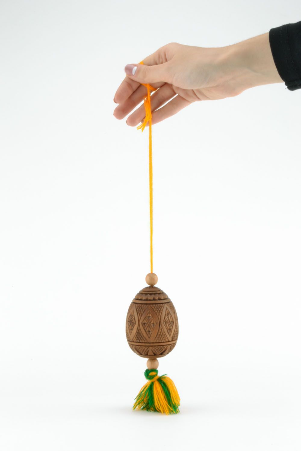 Carved Easter egg in the form of interior pendant photo 2